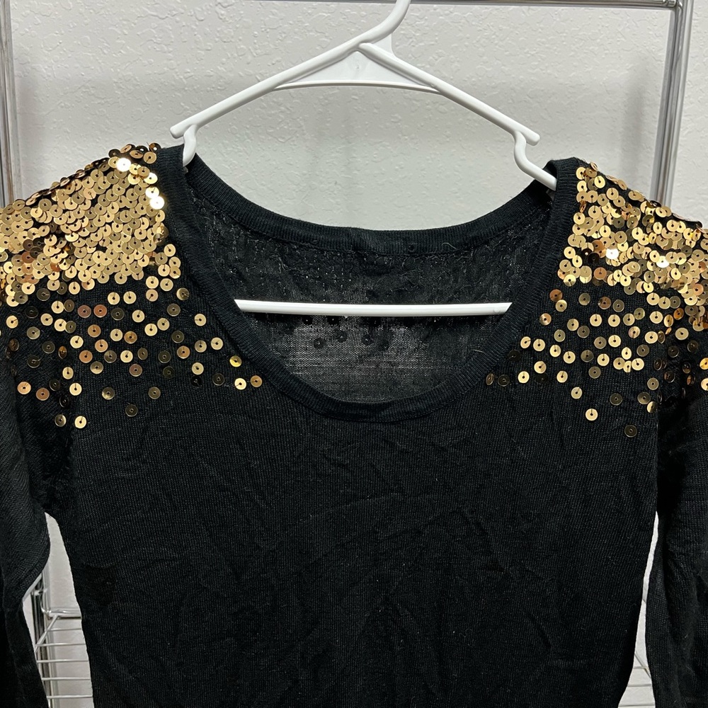 Beautiful vibrant black dress with gold sequence.